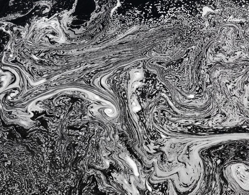 Polluted water surface with detergent or soap. Environmental damage. Abstract background